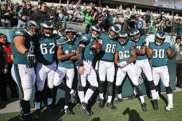 Philadelphia Eagles offensive players celebrate Eagles tight end Zach Ertz’s first-quarter touchdown against the Chicago Bears.