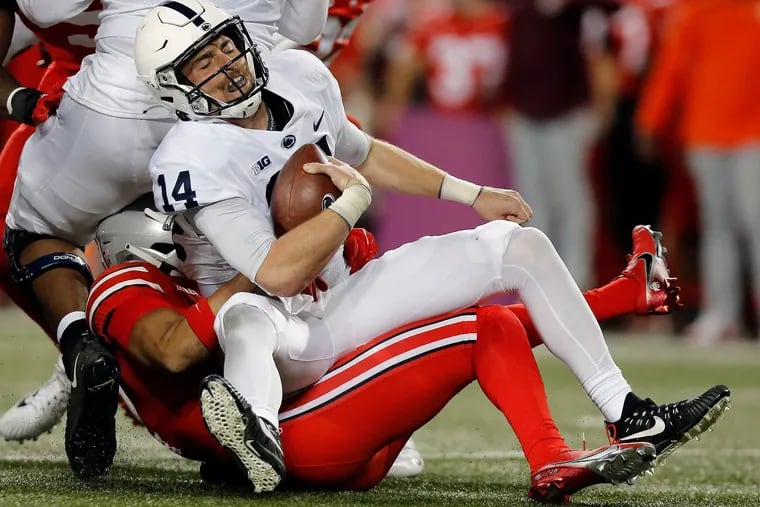 Ohio State safety Lathan Ransom sacks Penn State quarterback Sean Clifford during the second quarter at Ohio Stadium.