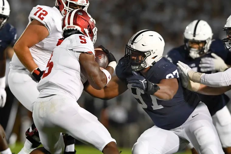 Penn State defensive tackle PJ Mustipher tackles Indiana running back Stephen Carr on Oct. 2.
