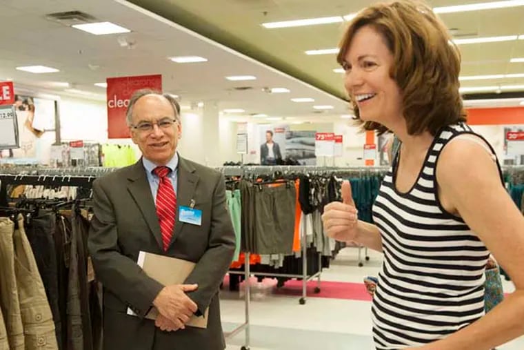Jim Boscov speaks with shopper Elizabeth Kauermann at the Boscov's in the Neshaminy Mall in Bensalem. The third generation to lead the department store chain, Boscov has hewn to a traditional model of customer service and slow but steady growth. (MICHAEL PRONZATO / Staff Photographer)