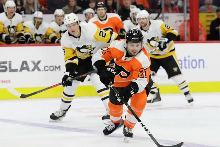 Flyers center Scott Laughton, shown skating past Pittsburgh's Nick Bjugstad last month, has been one of the team's most improved players.