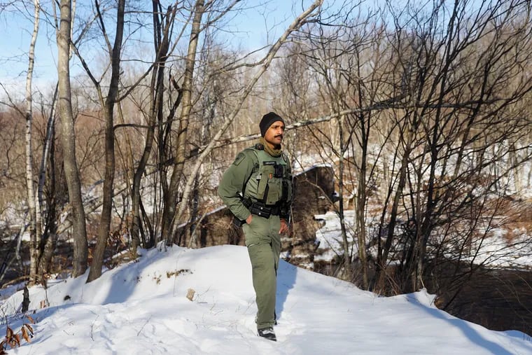 State game warden Praveed Abraham stands for a portrait at State Game Lands 127 in Coolbaugh Township, Pa., on Friday, Jan. 8, 2021.