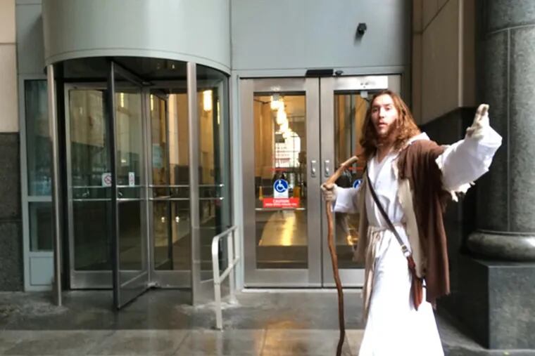 Sheriffs at the Criminal Justice Center made Philly Jesus check his trademark staff before entering the court. (Stephanie Farr/Philadelphia Daily News)