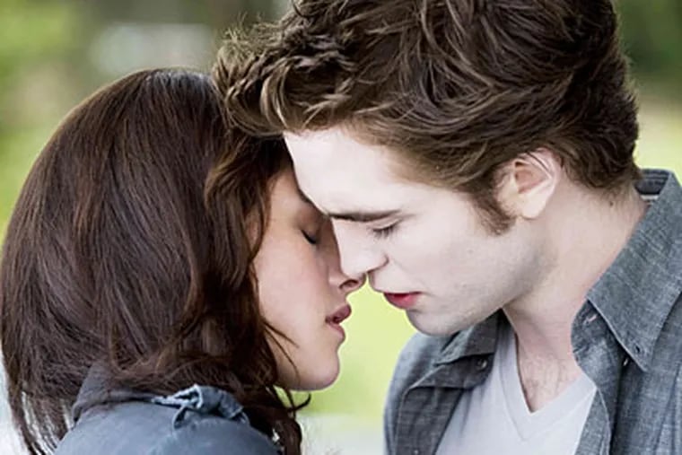 Kristen Stewart stars as Bella Swan and Robert Pattinson stars as Edward Cullen in "The Twilight Saga's New Moon."