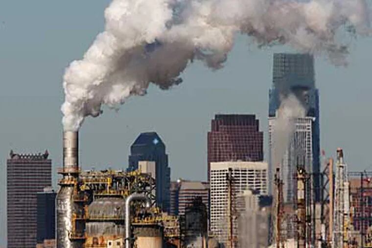 The Sunoco Refinery blows smoke into the air south of Center City. ( Michael Bryant / Staff Photographer )
