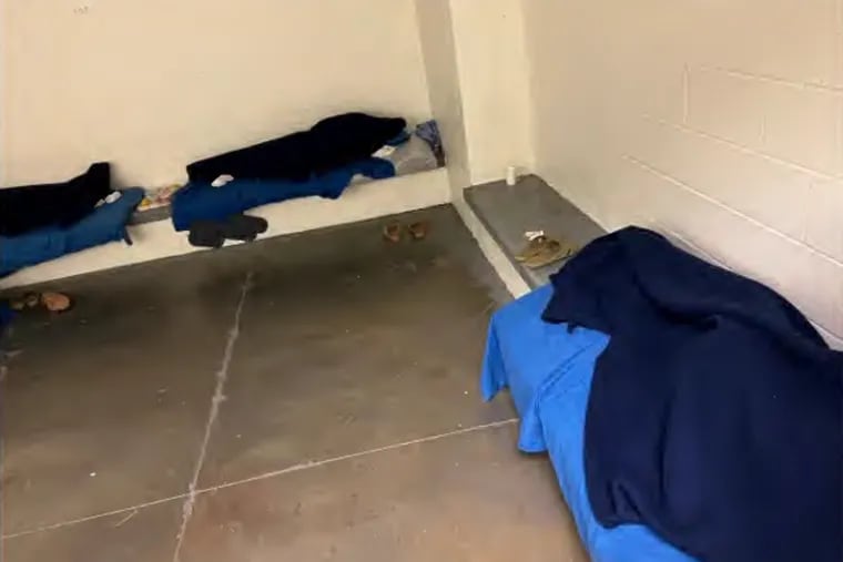 A photo included in a recent court filing showed children sleeping on benches and the floor inside Philadelphia's Juvenile Justice Services Center. The city blurred identifying features of the children to protect their privacy.