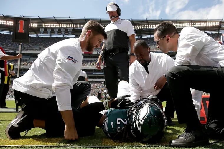 Eagles free safety Avonte Maddox is checked out after he was injured in the opener against Washington.