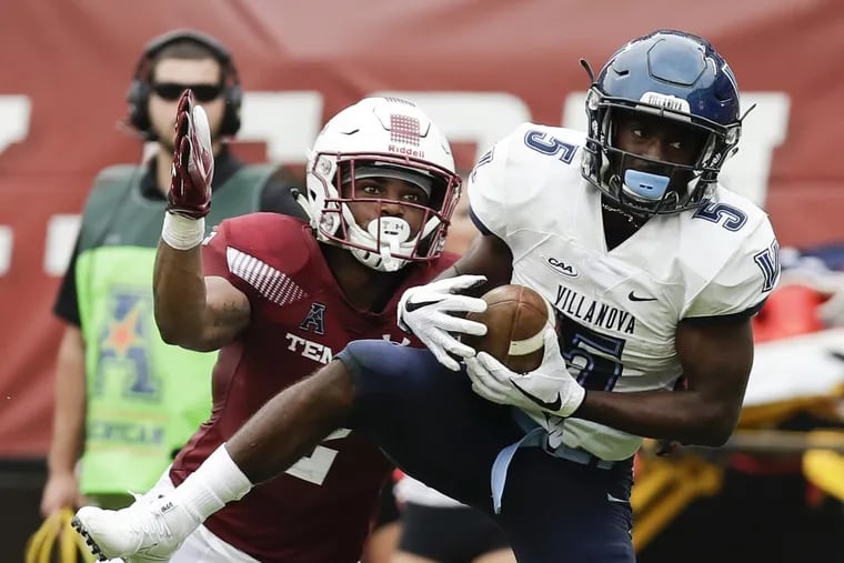 Villanova wide receiver Jarrett McClenton (right) catches the football past Temple safety Delvon Randall during the fourth-quarter on Saturday, September 1, 2018. McClenton scored a touchdown after the catch. YONG KIM / Staff Photographer