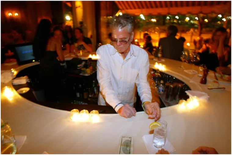 Restaurateur Neil Stein behind the bar at his restaurant Rouge in September 2004.