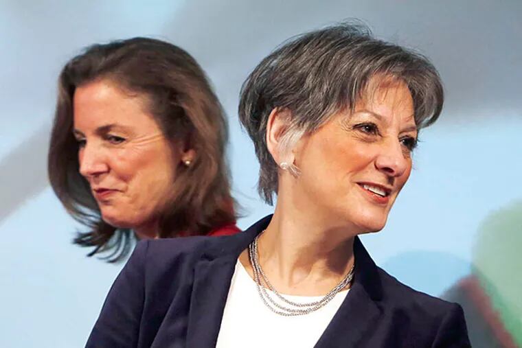 U.S. Rep. Allyson Schwartz, right, takes her seat prior to a gubernatorial candidates forum Tuesday Feb. 4, 2014  in Philadelphia. Schwartz recently voted for a farm bill supported by Gov. Corbett and the GOP majority and then got attacked by the GOP for it.  (AP Photo/Jacqueline Larma)