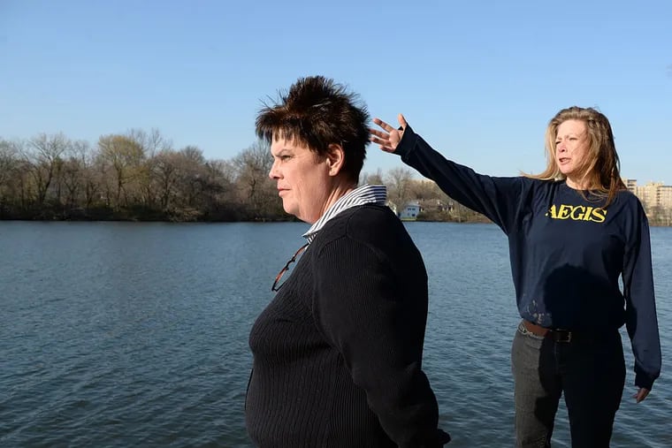 Melissa Martin, left, and neighbor Sandy Harris are part of a grassroots effort to clean up Newtown Lake, which is currently at a seasonal pristineness that will unfortunately soon give way to a spatterdock-infested waterway.