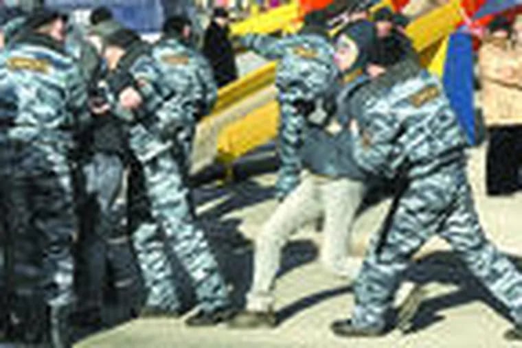 Police detain protesters during a rallyin Vladivostok. Though the rallies started over car fees, they now reflect general discontent.