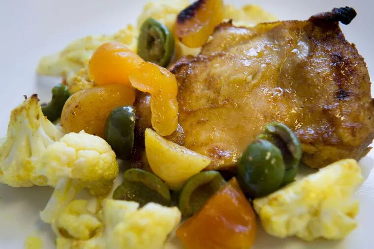Curried chicken sits on a bed of cauliflower, olives and apricots in the My Daughter's Kitchen afterschool cooking program at Prince Hall Elementary School in Philadelphia.