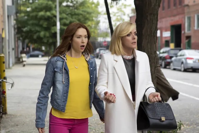 In this image released by Netflix, Ellie Kemper, left, and Jane Krakowski appear in a scene from "Unbreakable Kimmy Schmidt," an original series on Netflix. (AP Photo/Netflix)