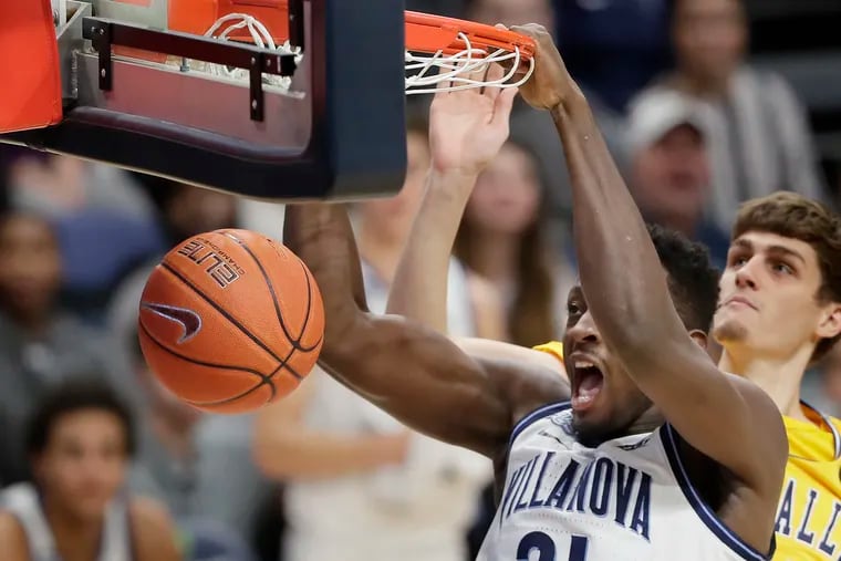 Villanova’s Dhamir Cosby-Roundtree dunks against La Salle in a 2019 game.