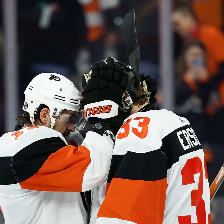Flyers right wing Travis Konecny and goaltender Samuel Ersson celebrate after beating the New Jersey Devils 1-0 on Saturday.