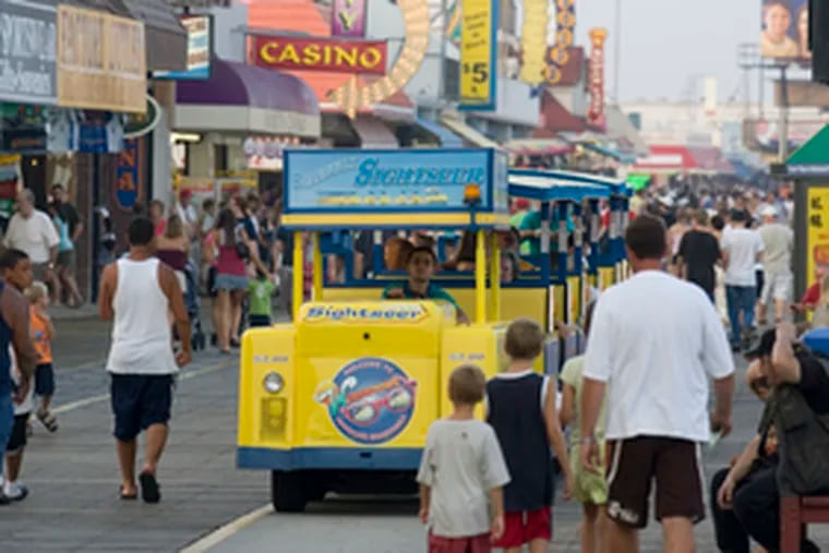 The popular tram makes its way down Wildwood's boardwalk. The three Wildwoods have wide, wide beaches and lots of boardwalk for a backdrop.