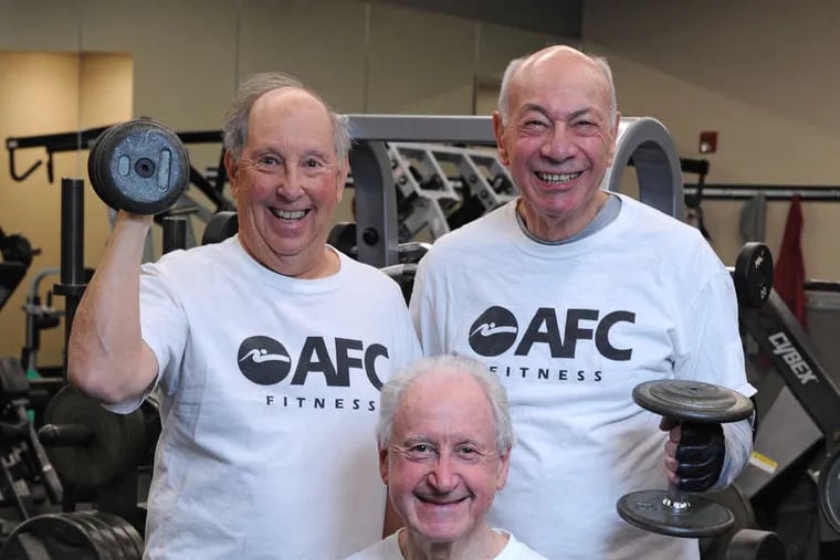 Fitness buddies Bernie Kauderer (seated), Jay Blumenthal (left), and Len Michaels at the gym in Jenkintown.