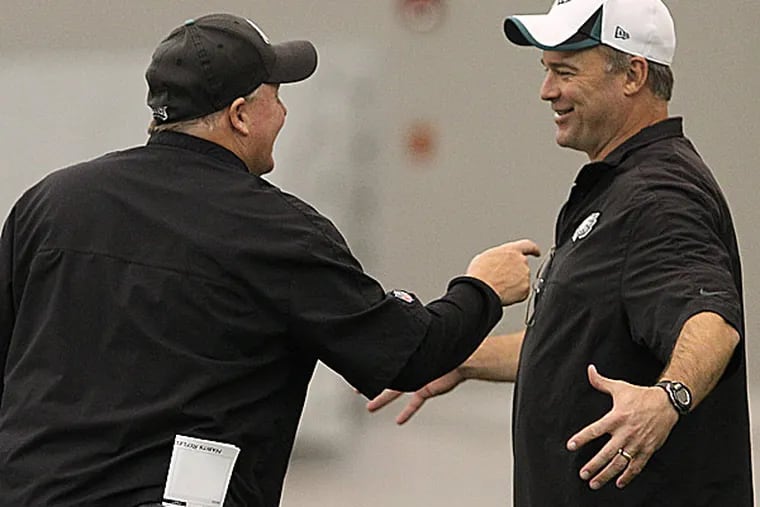 Eagles head coach Chip Kelly and defensive coordinator Bill Davis. (David Maialetti/Staff Photographer)