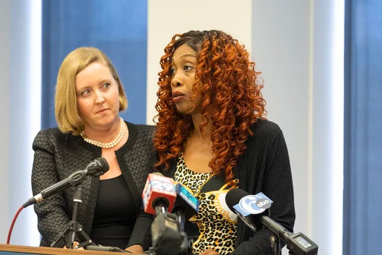 Angel Davis and her attorney Bethany Nikitenko (left) at a news conference Tuesday. Davis, who was shot in the head in March by a private security contractor during an eviction from her apartment, is suing Marisa Shuter, Philadelphia’s landlord-tenant officer.