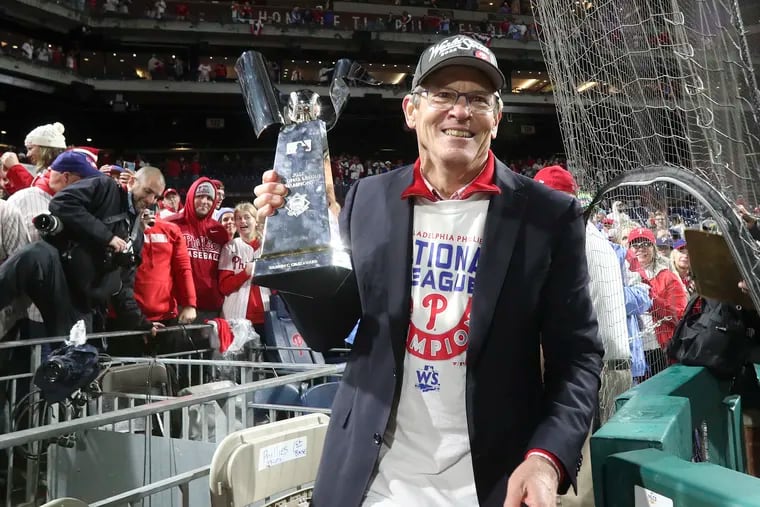 Phillies managing partner John Middleton holding the National League Championship trophy on Oct. 23.