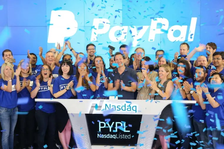 PayPal CEO Dan Schulman (center) and employees ring the opening bell at the Nasdaq MarketSite in New York. PayPal shares jumped in the firm's first day as a separate and publicly traded company as it outlined plans to capitalize on the rise of mobile payments and the growing digitization of money. PayPal was acquired by EBay in 2002. The shares gained 5.6 percent to $40.55 at 11:39 a.m. and closed at $40.47.