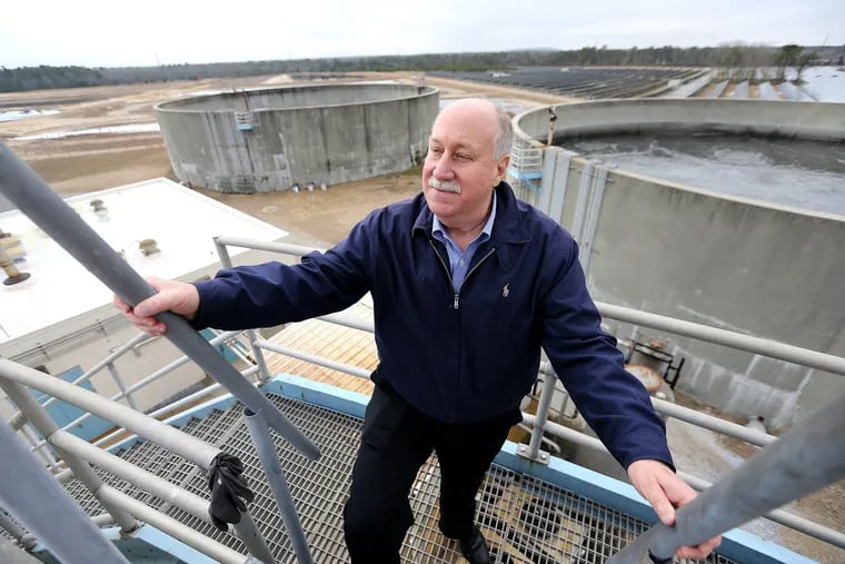 Dennis Palmer, executive director, looks over one of the sewage holding tanks at Landis Sewerage Authority in Vineland.