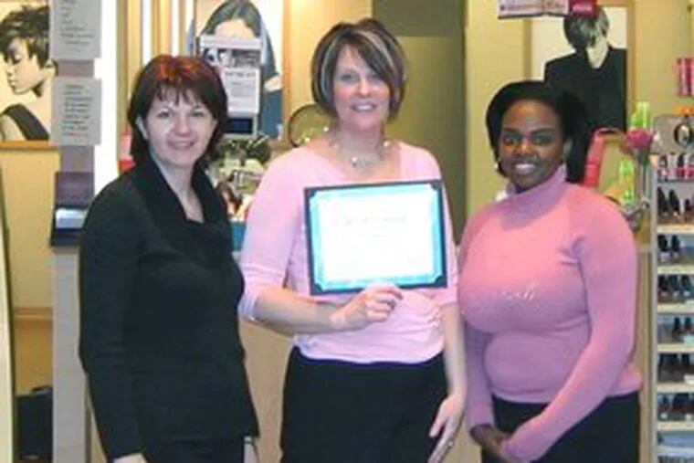 Regis Salon employees (from left) Yatza Baranac, Anne Siket and Brittany Savanders were recognized by the Moorestown Mall.