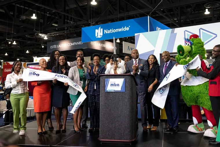 Members gathered during an opening ceremony for the start of the National Black MBA Association job fair on Thursday, Sept. 14, 2023, at the Convention Center in Philadelphia. The convention and job fair brings together local and national companies looking to hire for remote, local, and relocation positions.