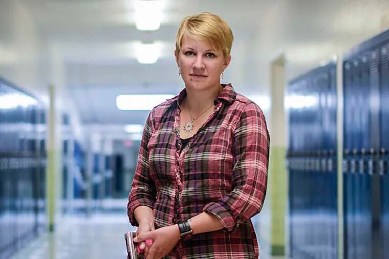 Kasey Hansen with her pistol at Valley Junior High School in Utah. &quot;I'm going to stand in front of a bullet for any student that is in my protection, and so I want another option to defend us.&quot;