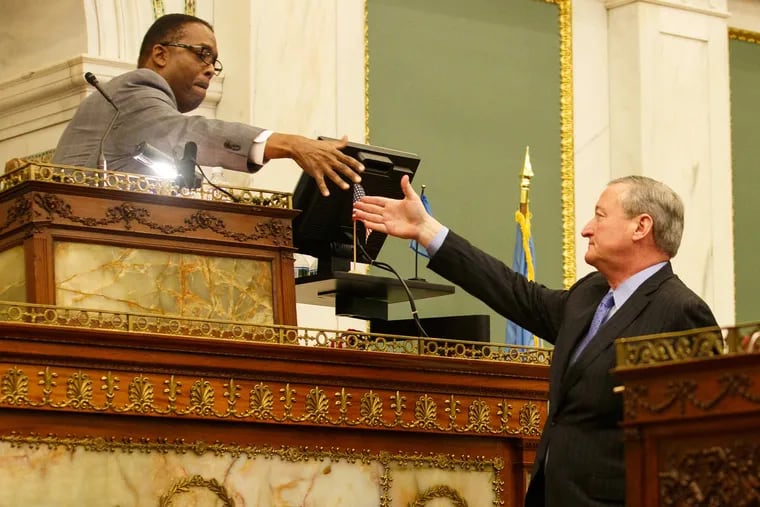 City Council President Darrell L. Clarke, left, greets Mayor James Kenney in Council chambers. Both men will leave office in January.