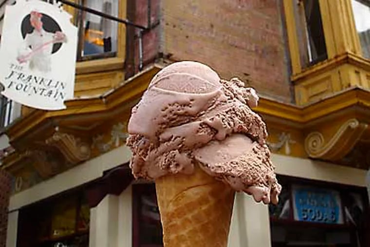 A one-scoop chocolate vegan ice cream cone from Franklin Fountain is seen outside the nostalgic Old City parlor.