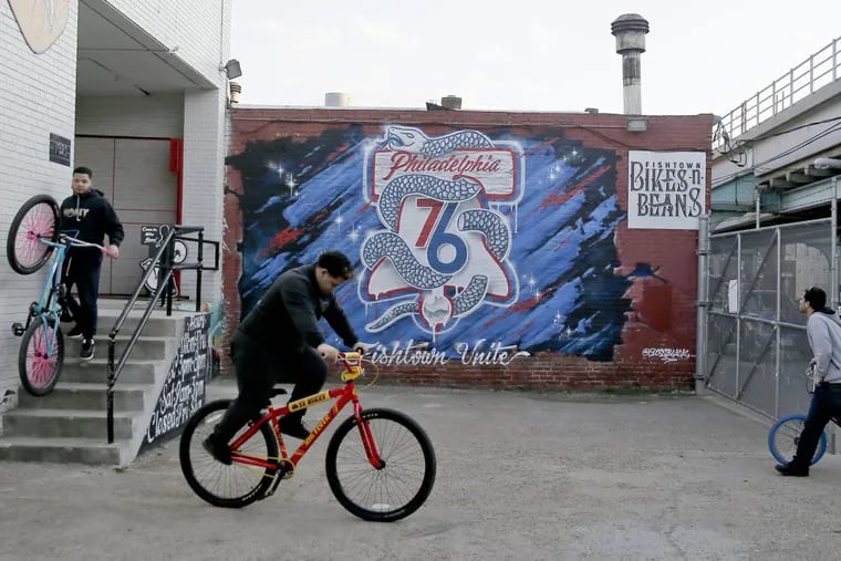 76ers mural by artist Gloss Black on wall at Fishtown Bikes-N-Beans at 1321 N Front St. in Philadelphia.
