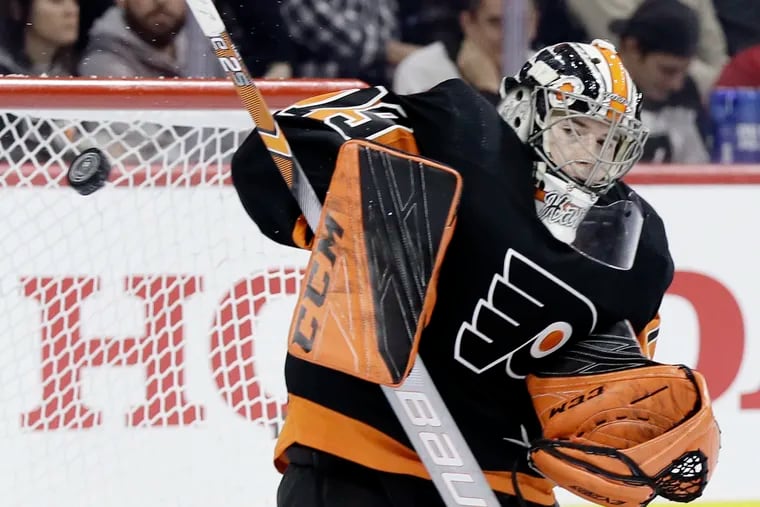 Flyers goalie Carter Hart, shown making a save during a regular-season game against the New York Rangers, helped Team Canada defeat France on Thursday.