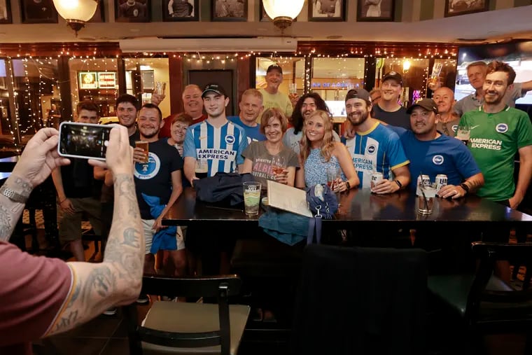 Members of the Philly Seagulls and other Premier League supporters clubs take a group photo to kickoff the summer series weekend at Fadó Irish Pub in Phila., Pa. on Thursday, July 20, 2023.