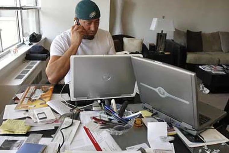 Craig “Quimby” Chenosky specializes in travel packages for Eagles away games. He was putting together travel plans for the Birds’ playoff game in Minnesota against the Vikings on Sunday. (Bonnie Weller / Staff Photographer)