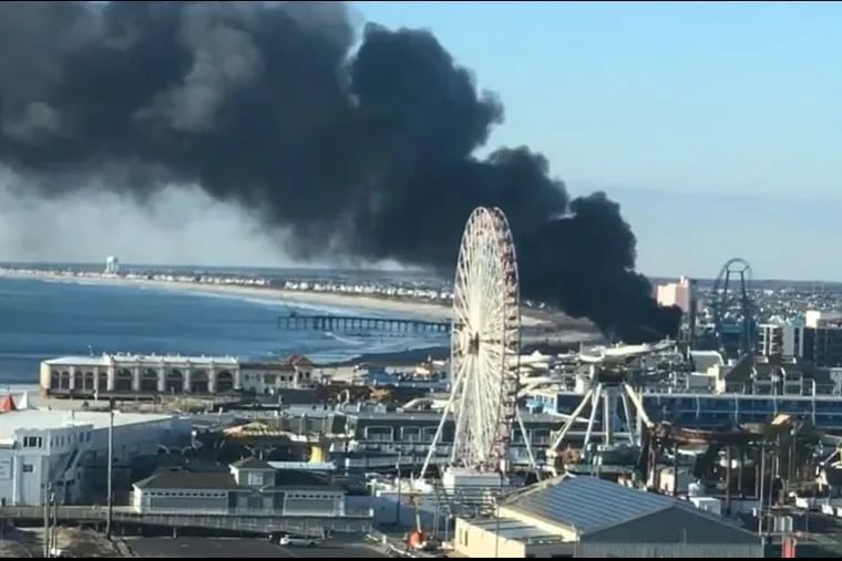This still taken from a Facebook Live video by Ocean City, N.J., resident George Flowers shows smoke billowing from the Ocean City boardwalk Saturday morning.