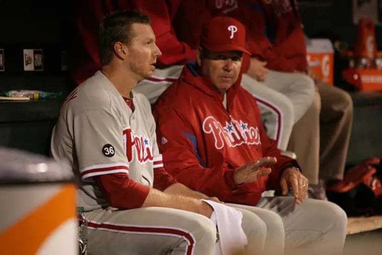 The relationship between the late Roy Halladay (left) and pitching coach Rich Dubee continues today, as Dubee's son, Michael, coaches Halladay's son, Ryan.