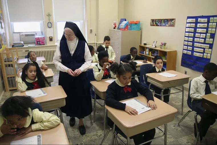 Sister James Anne teaches her second-grade English language learning class at St. Francis De Sales School in West Philadelphia.