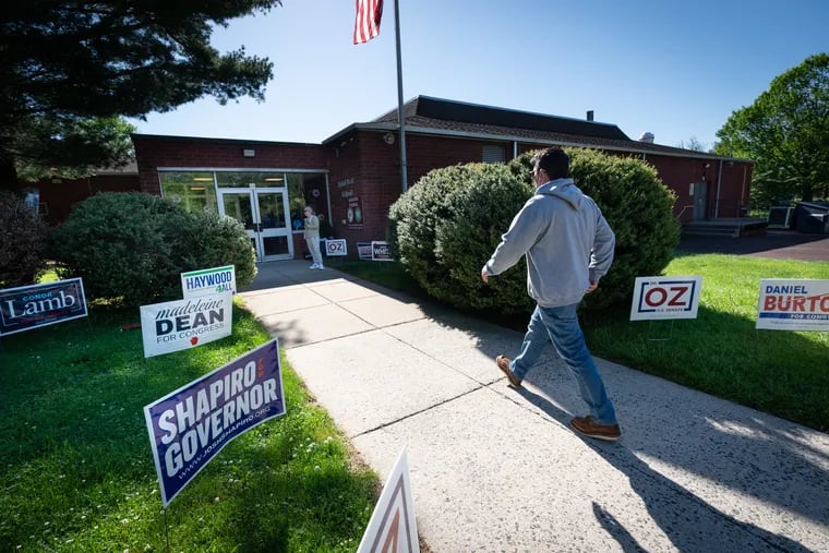A man arrives to vote at Rydal West Elementary School, in Rydal, Pa., last month for the May 17 Pennsylvania primary election.
Voters turned out in record numbers for a midterm primary for both parties.