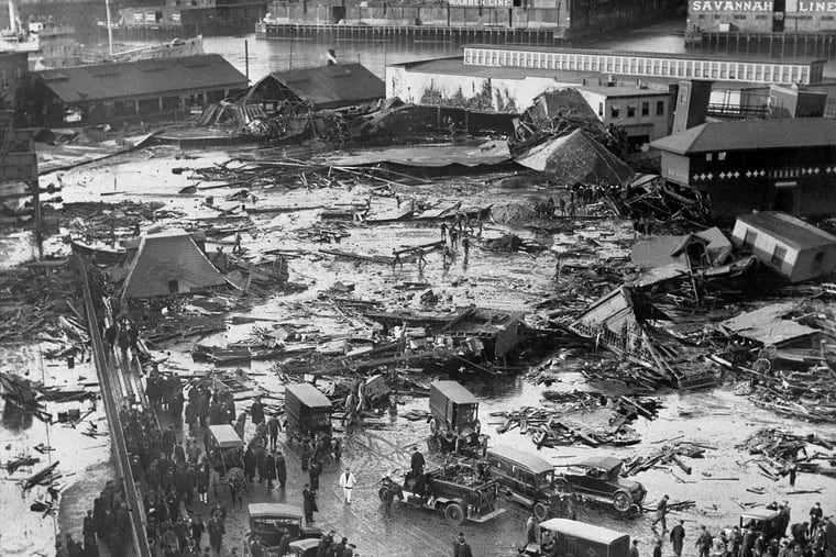 FILE - In this Jan. 15, 1919, file photo, the ruins of tanks containing more than 2 million gallons of molasses lie in a heap after erupting along the waterfront in Boston's North End neighborhood. Several buildings were flattened in the disaster, which killed 21 people and injured 150 others.
