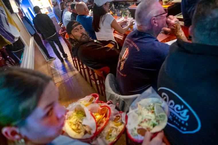 Tacos and other menu items are served at the bar at Gregory's in Somers Point N.J. on Taco Tuesday, May 23, 2023. The Bar/restaurant registered a trademark of the phrase “Taco Tuesday” in 1982 in New Jersey and the chain, Taco John's, owns it in all the other 49 states. But Taco Bell wants to “liberate” it, releasing the trademark for use “to all who make, sell, eat and celebrate tacos.”