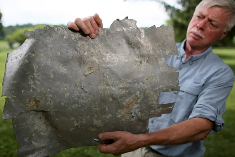 Could this aluminum panel, found on a remote Pacific island, have replaced a rear window on Amelia Earhart's Lockheed Electra? Ric Gillespie, leader of TIGHAR, a group striving to solve her disappearance, says new evidence suggests the chances are highly likely. (JOSEPH KACZMAREK / Courtesy of TIGHAR)