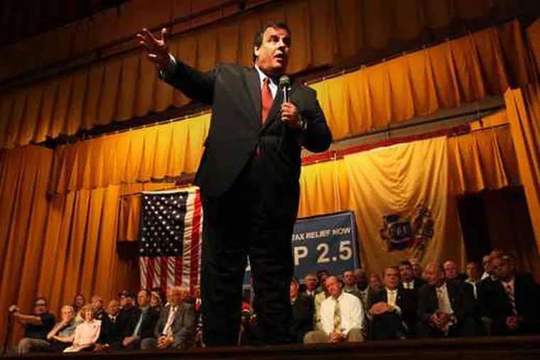 Gov. Christie answers questions at the standing-room-only town hall meeting in Greenwich Township. Many in the audience applauded when he said public employees had been shielded from economic realities and should share in the sacrifice.