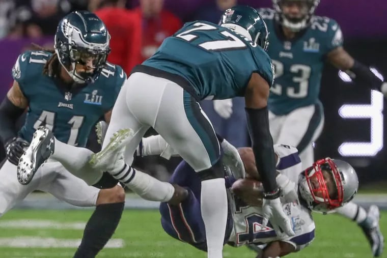 Eagles safety Malcolm Jenkins knocks New England's Brandin Cooks out of the game with a jarring hit in the Super Bowl.