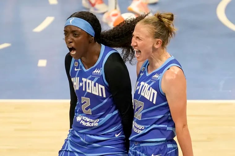 The Chicago Sky's Kahleah Copper (left) and teammate Courtney Vandersloot celebrate in a game against the Connecticut Sun on June 17.