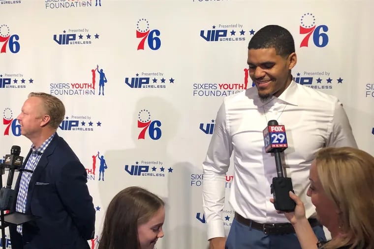 Tobias Harris talks to a young fan at the Sixers Youth Foundation Gala on Monday at the Fillmore in Fishtown.