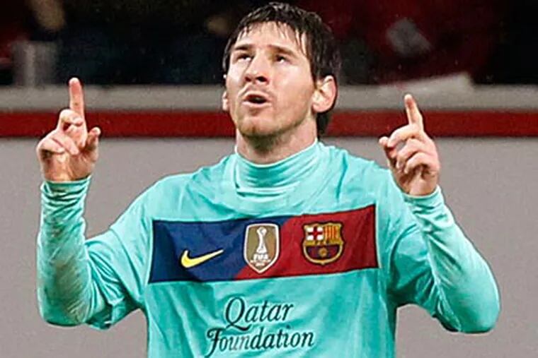 Lionel Messi scored one goal in Barcelona's 3-1 Champions League win at Leverkusen. (Roberto Pfeil/AP)