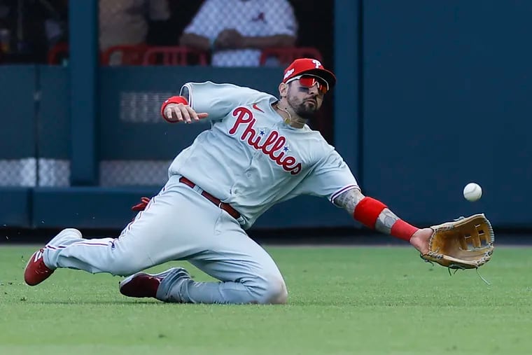 Phillies right fielder Nick Castellanos makes a sliding catch for the second out of the ninth inning in Game 1 against the Atlanta Braves.