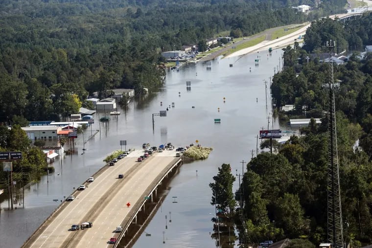 Highway 96 sits submerged by floodwaters from Tropical Storm Harvey on Friday, Sept. 1, 2017, in Lumberton, Texas.